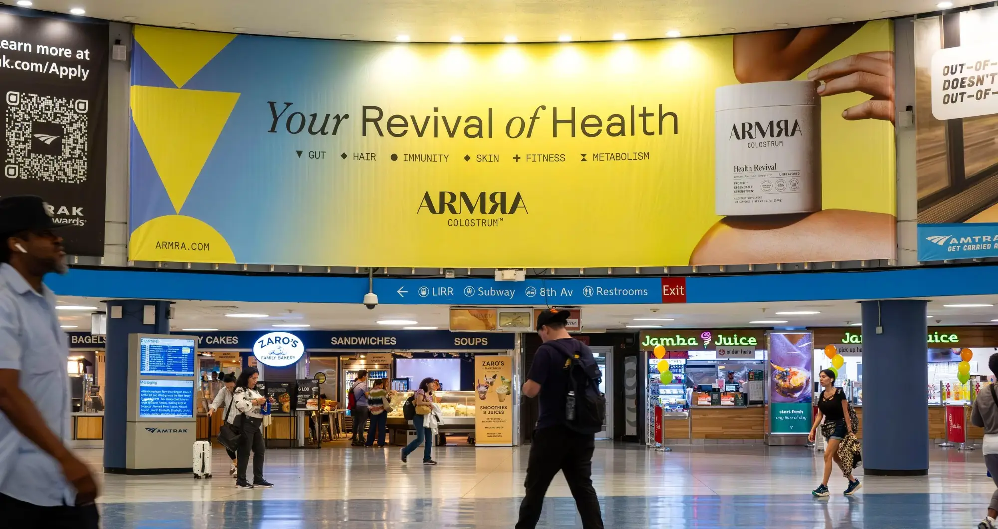 ARMRA “Your Revival of Health” banner above the Penn Station concourse