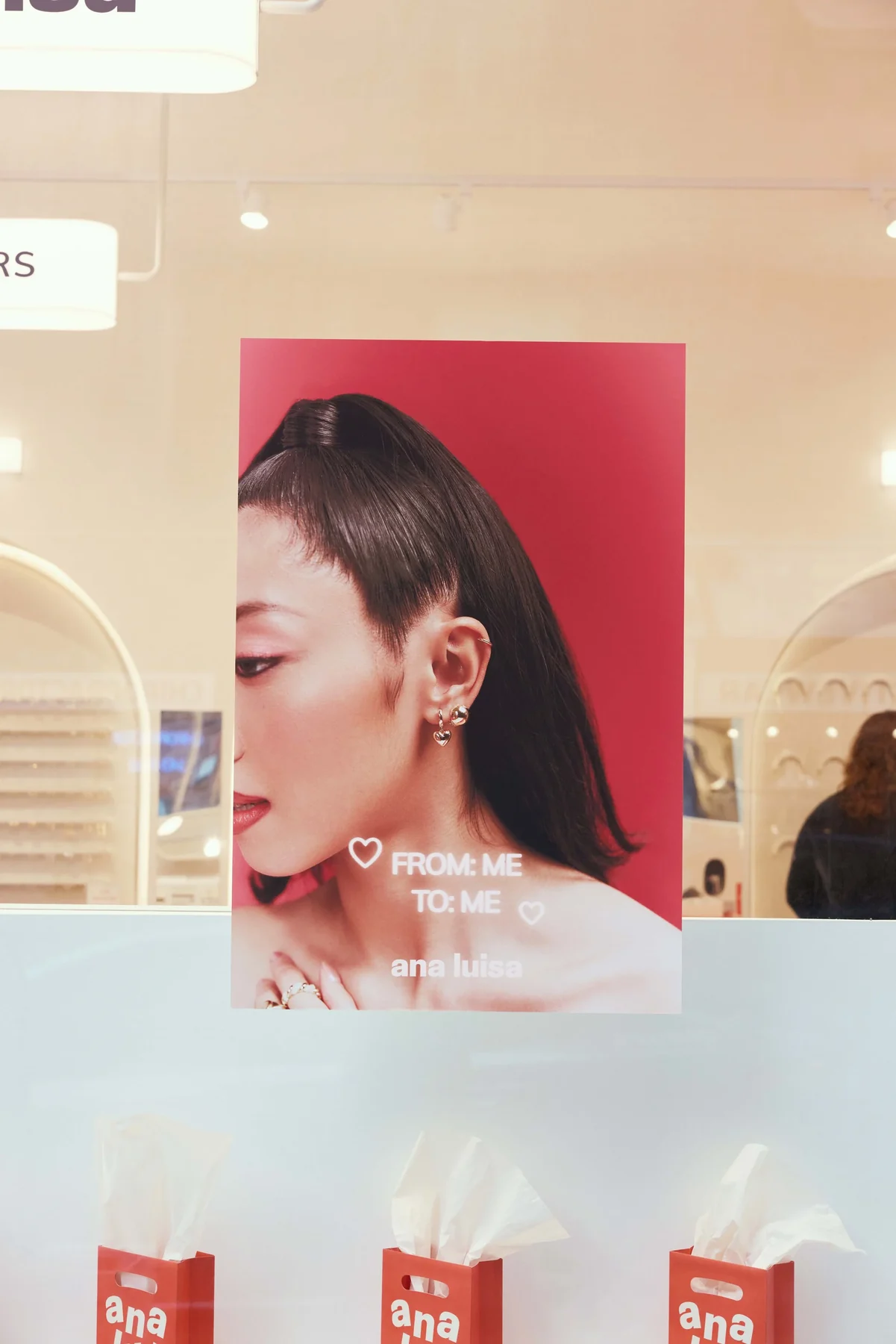 “From me to me” poster in the store window