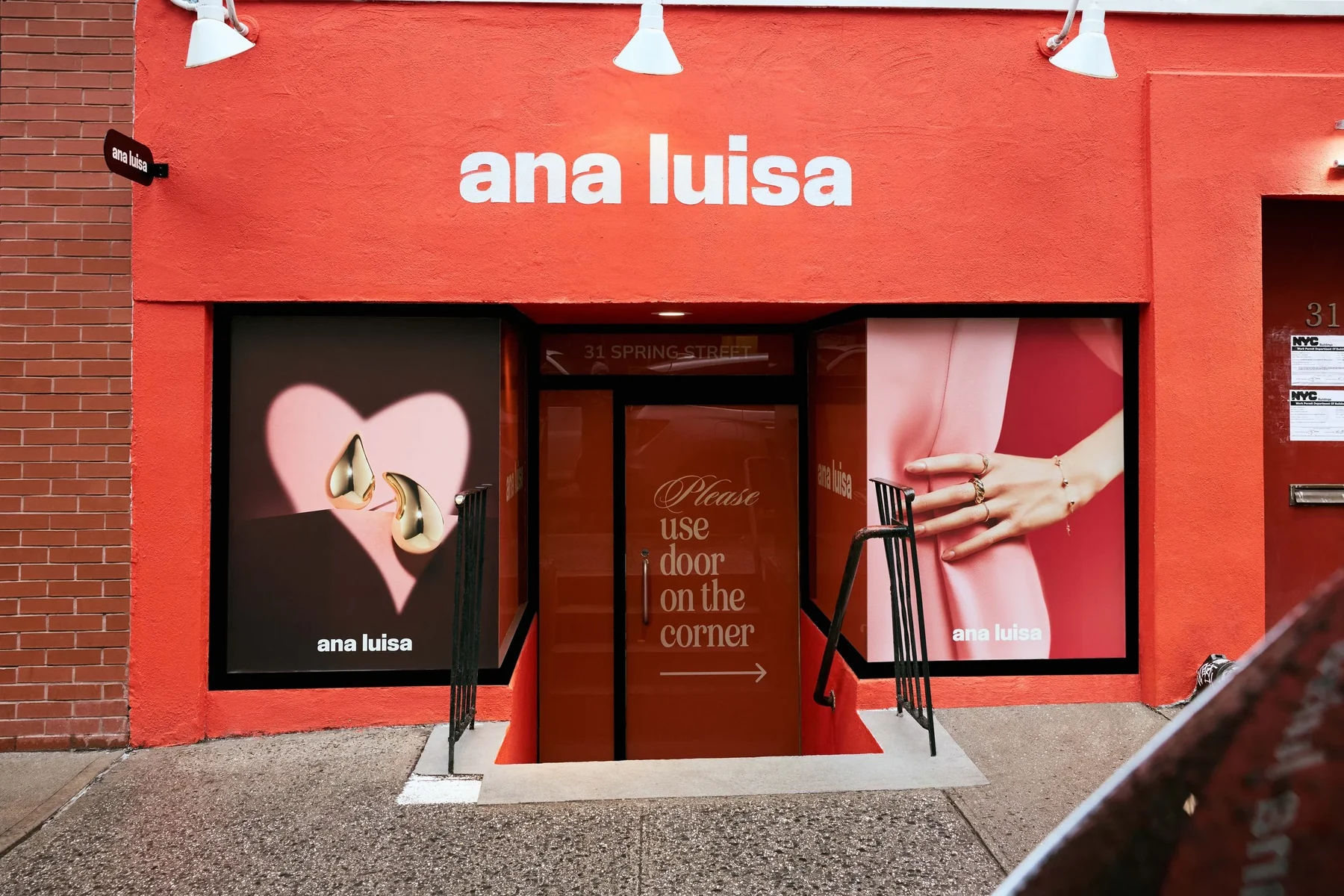 Red Ana Luisa storefront with a heart in the window