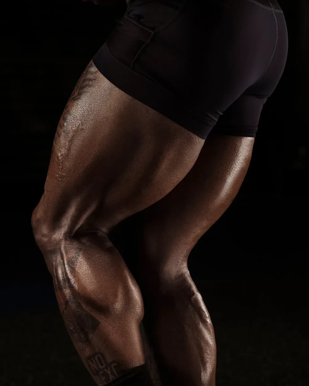 Legs target: close crop of quads and hamstrings mid-stride